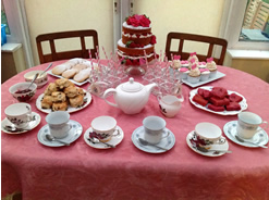 Traditional Cakes and Tea on a Dessert Table